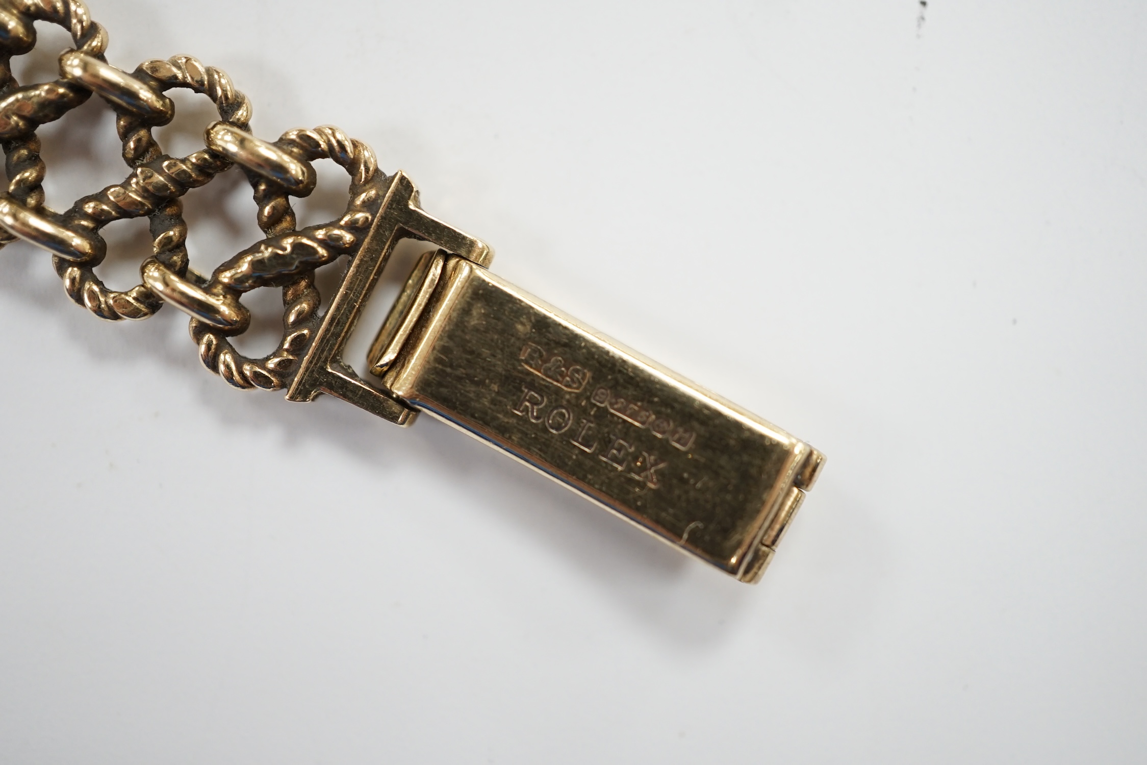 A lady's late 1950's 9ct gold Tudor Royal manual wind wrist watch, on a 9ct gold Rolex bracelet, overall 18.5cm, gross 22 grams, with Rolex box.